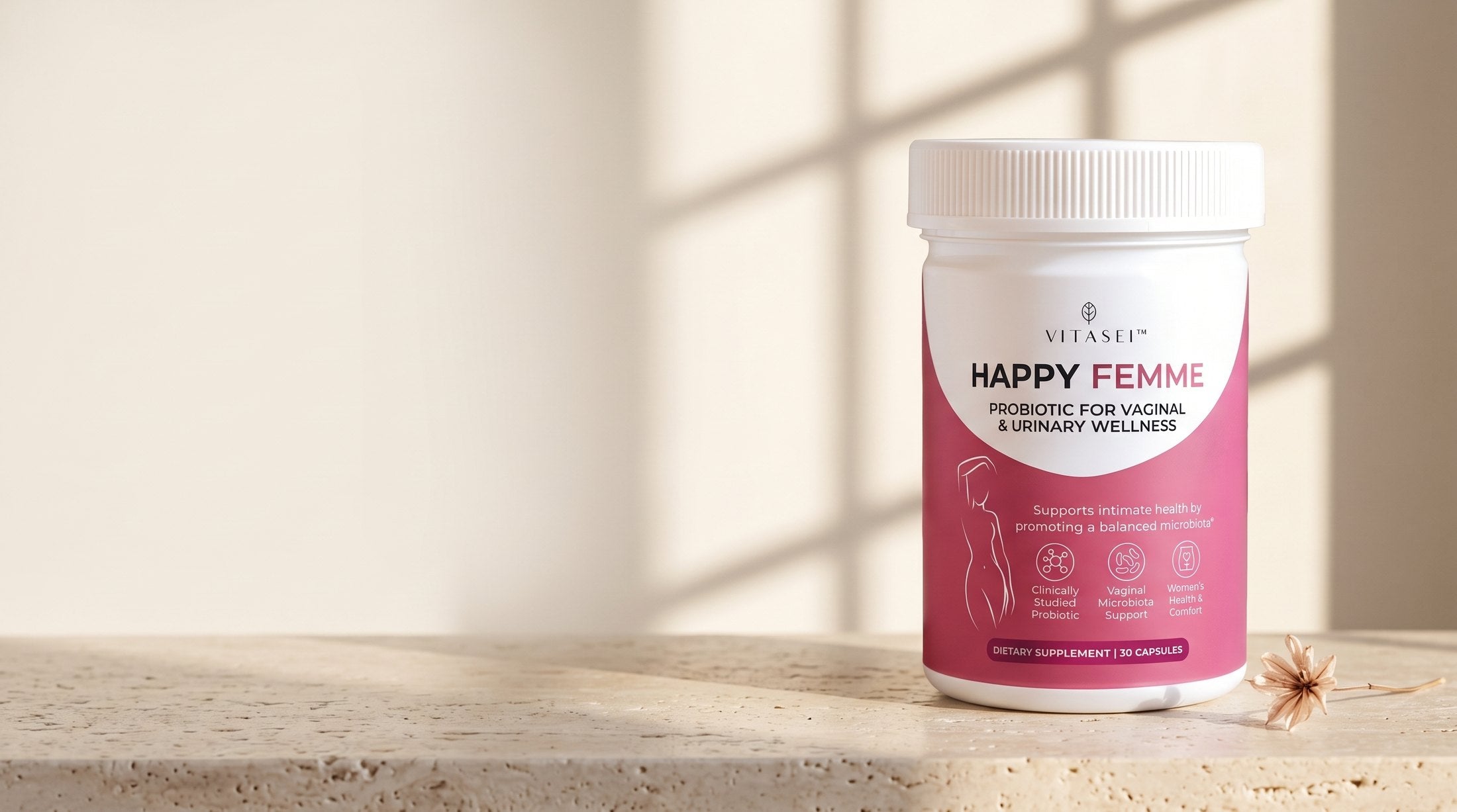 Happy Femme probiotic jar on a travertine surface